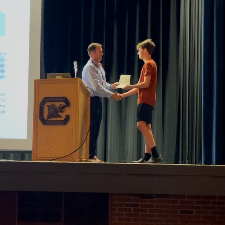 Last night Davis Crosley was presented with the Blue Devil Challenge Coin. He showed exemplary Blue Devil Pride through his participation in a fundraiser, raising over $1,000 for our track and cross country programs. #BDP #BetterEveryDay #ForksUp