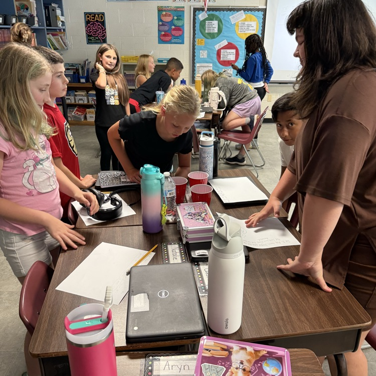 Mrs. Day’s 5th grade class using melting ice to make hypotheses and learn about scientific processes. 