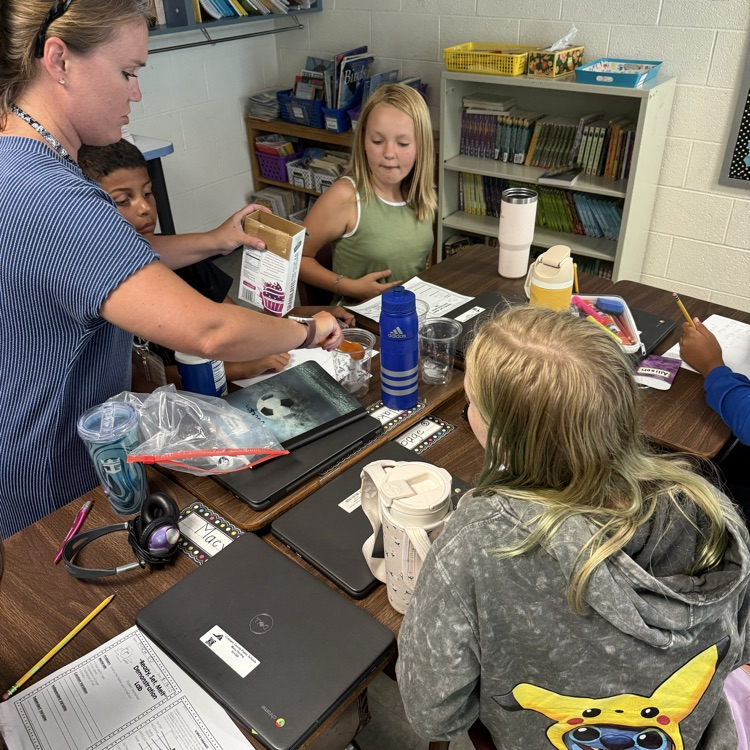 Mrs. Day’s 5th grade class using melting ice to make hypotheses and learn about scientific processes. 