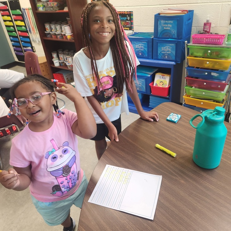 Mr. Hallett's fifth graders worked with our kindergartners yesterday on writing their name!