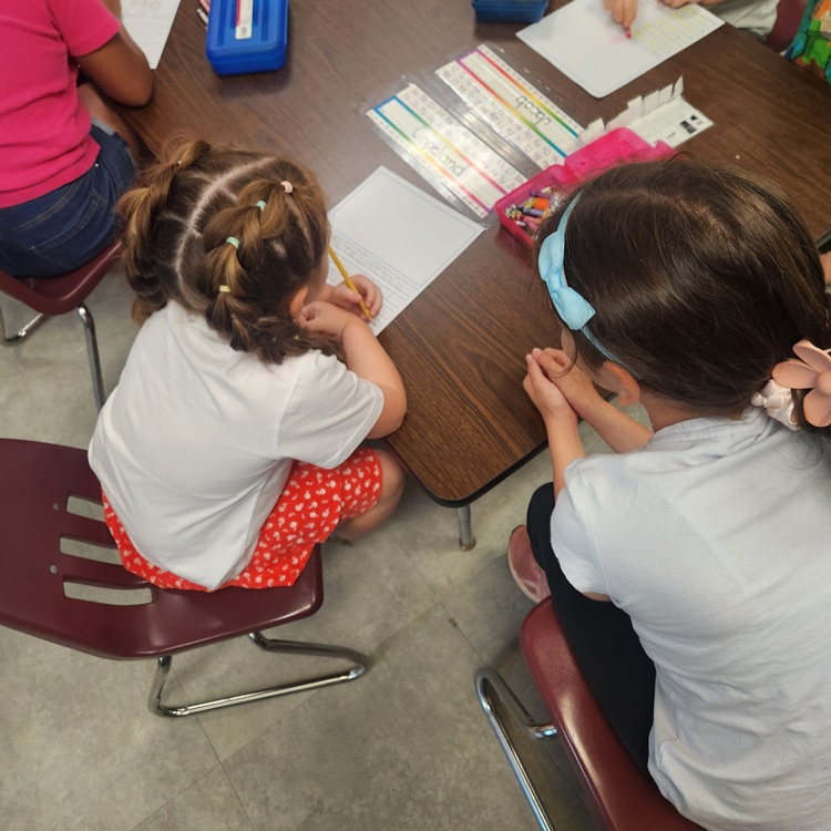 Mr. Hallett's fifth graders worked with our kindergartners yesterday on writing their name!