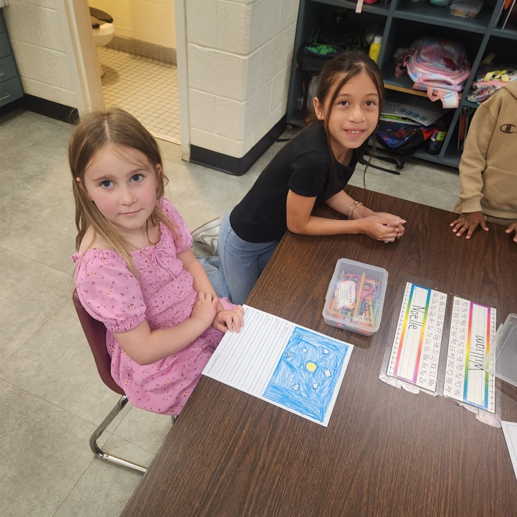 Mr. Hallett's fifth graders worked with our kindergartners yesterday on writing their name!