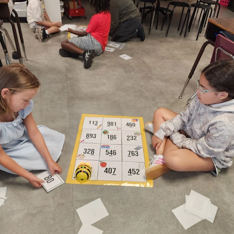 Third graders in Mrs. Sink's class woke the Bee Bots from their summer slumber - they were the first class to use these coding devices.  All the while they were showing their knowledge of place value.