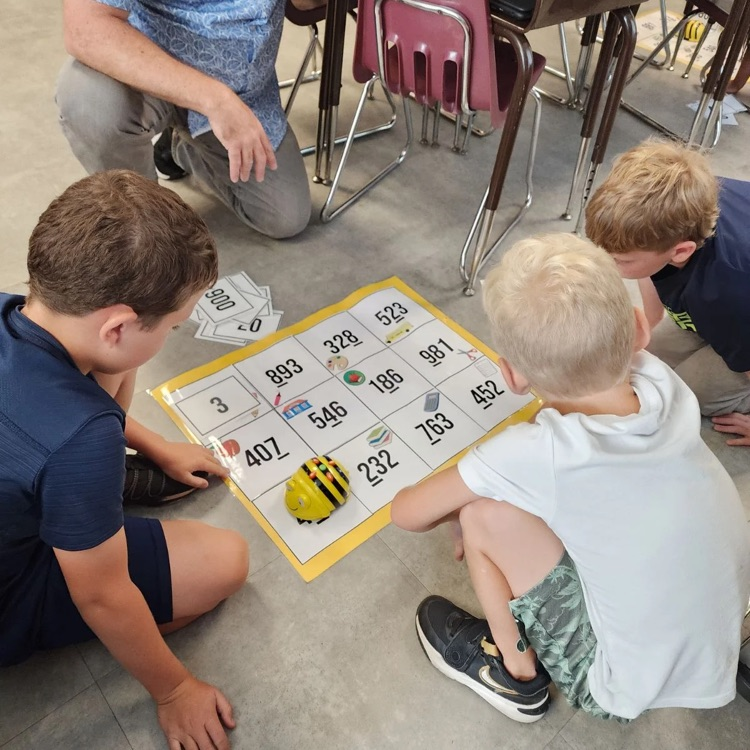 Third graders in Mrs. Sink's class woke the Bee Bots from their summer slumber - they were the first class to use these coding devices.  All the while they were showing their knowledge of place value.