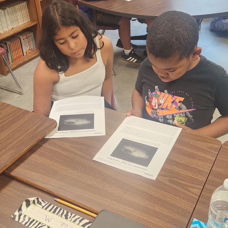 Mr. Hallett's 5th graders on Day 4 of paired readings, starting to get the hang of it!