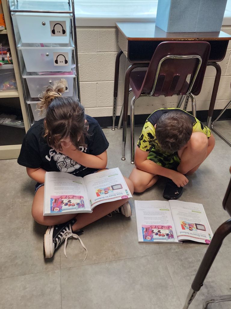 Pictured here, Mrs. Sink's 3rd Graders practiced some partner reading!