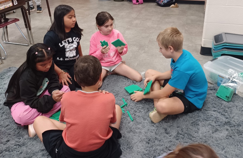 Ms. C's 3rd graders are working in teams with place value. We are place value champs and we can represent numbers 2 different ways into the hundreds. 