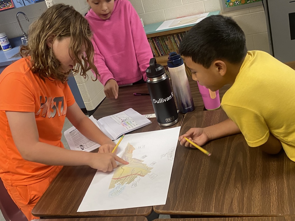 Students in Miss Simpson's 4th Grade class are seen here working on Virginia maps as a cumulative project identifying regions, major waterways, as well as each region's top products and industries. 