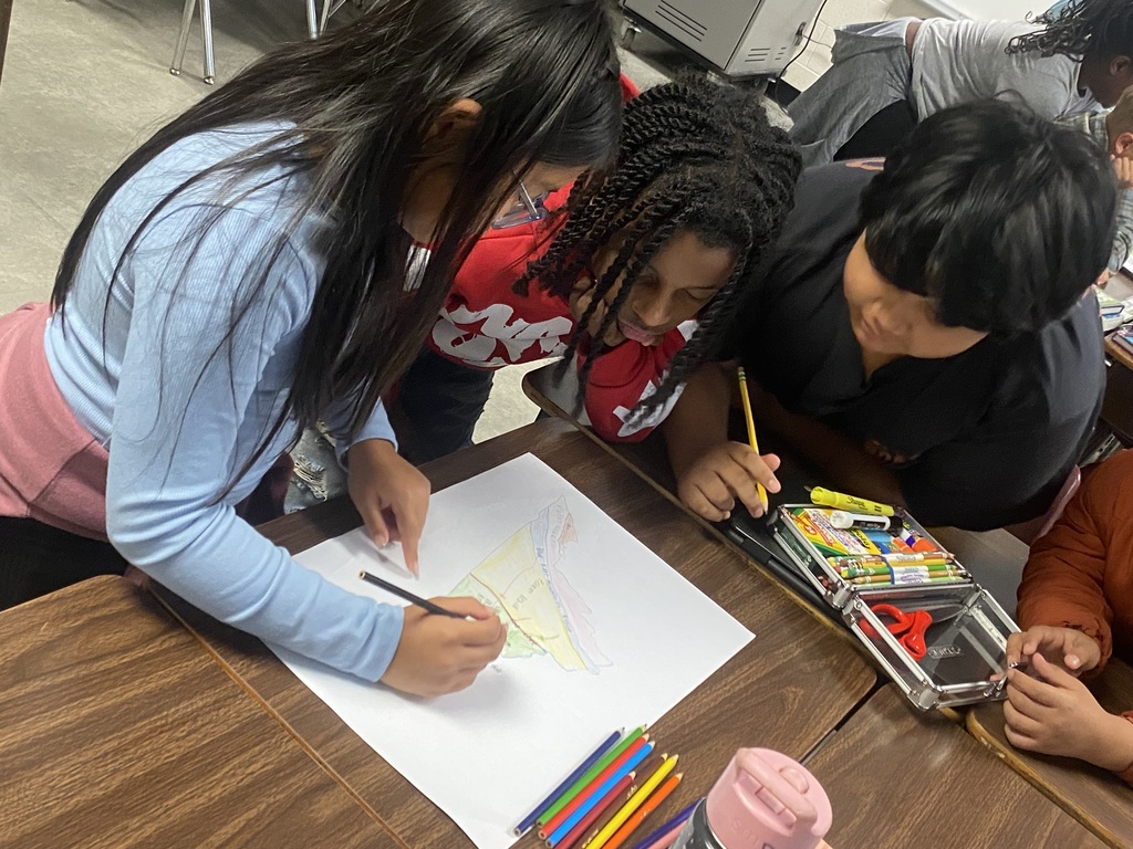 Students in Miss Simpson's 4th Grade class are seen here working on Virginia maps as a cumulative project identifying regions, major waterways, as well as each region's top products and industries. 