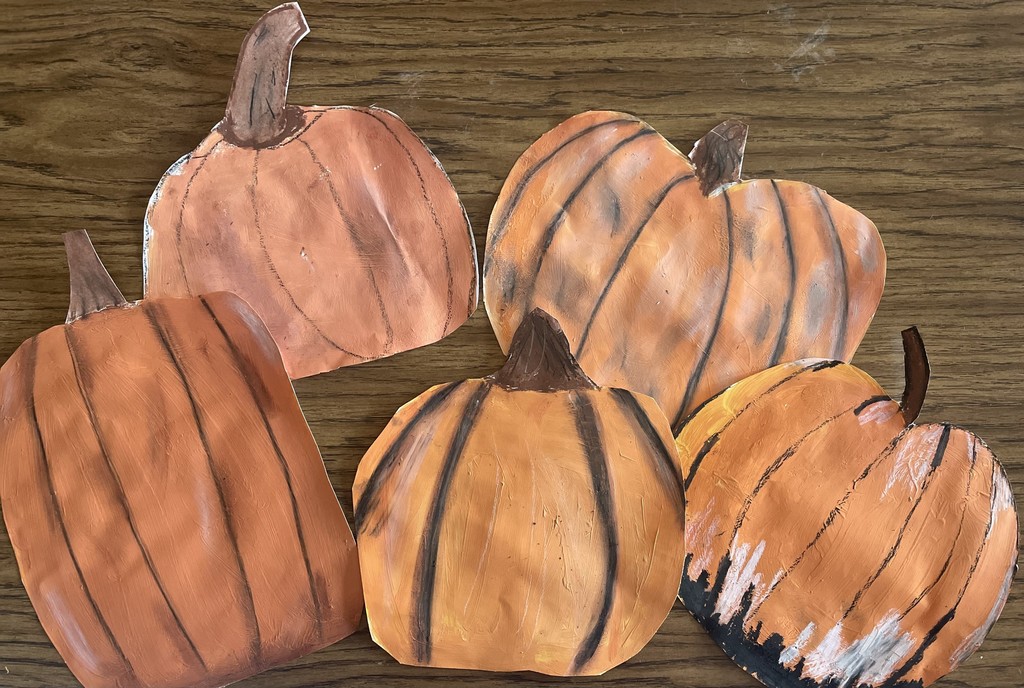 Image contains 5 student painted pumpkins