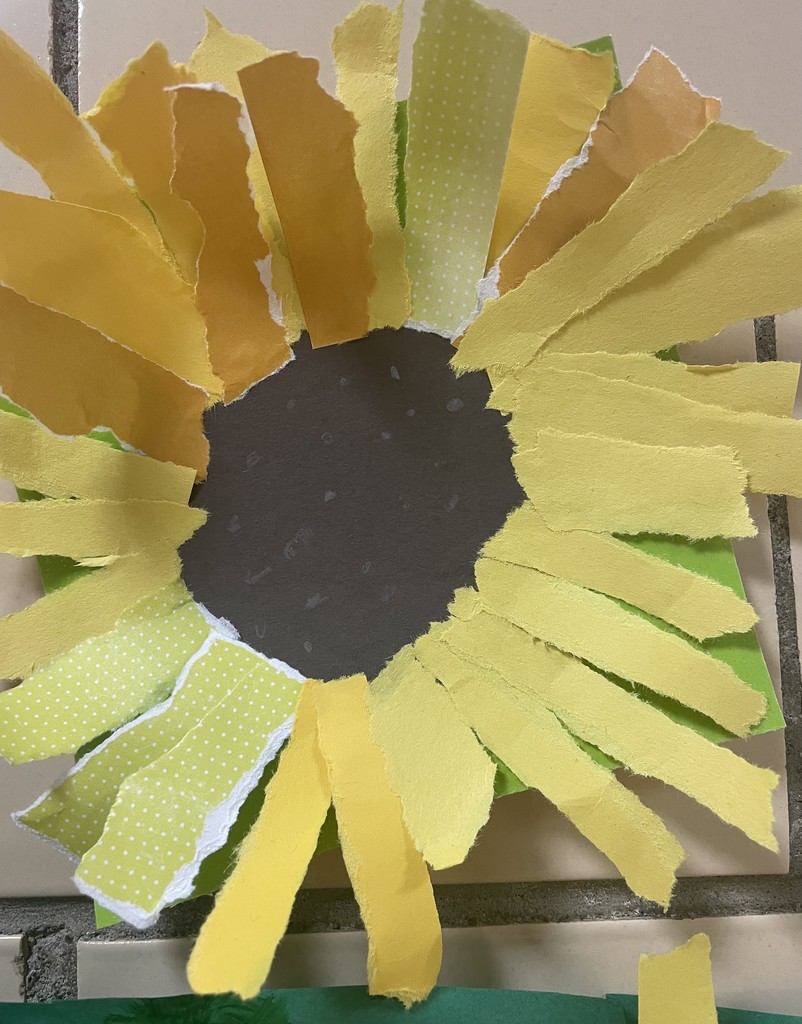 Image contains a flower artwork (sunflower)