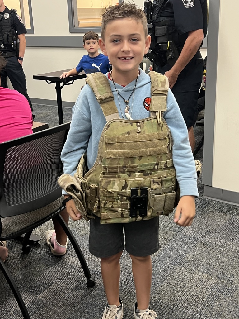 Student wearing police vest