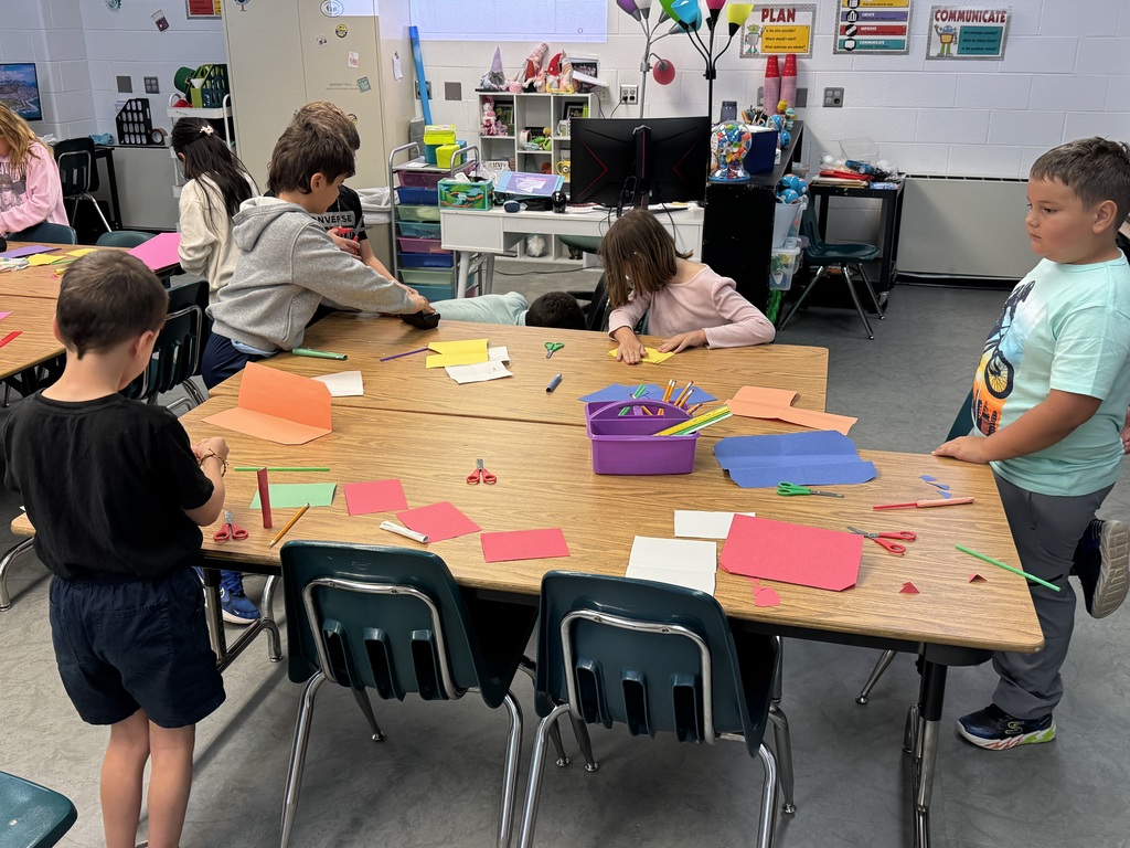 Students building paper rockets in STEM lab
