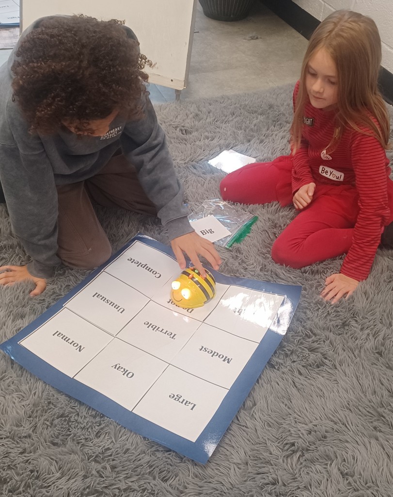 In Ms. Ciccarone's 3rd Grade class, students are pictured here practicing synonyms and antonyms with beebots. Earlier, they were learning to set goals and work toward achieving them! #teamwork