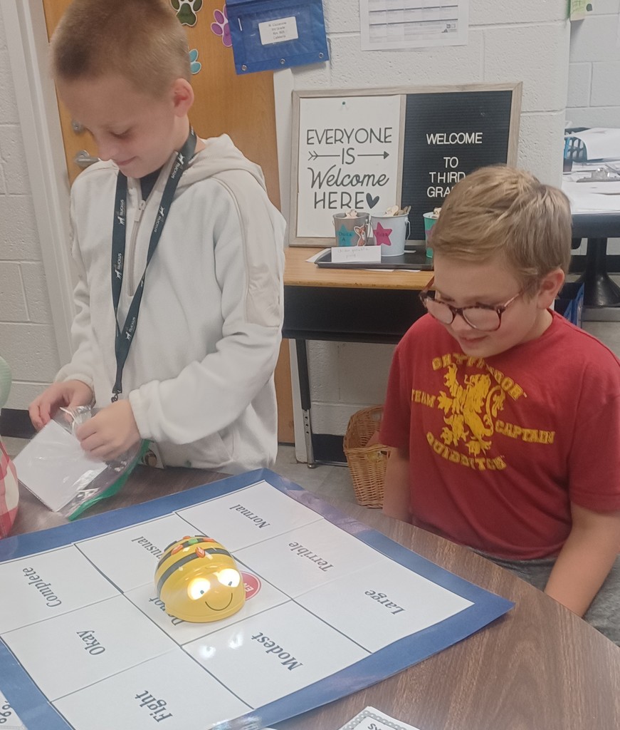 In Ms. Ciccarone's 3rd Grade class, students are pictured here practicing synonyms and antonyms with beebots. Earlier, they were learning to set goals and work toward achieving them! #teamwork