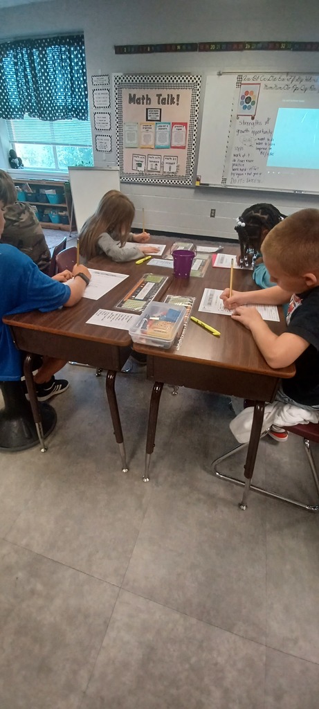 In Ms. Ciccarone's 3rd Grade class, students are pictured here practicing synonyms and antonyms with beebots. Earlier, they were learning to set goals and work toward achieving them! #teamwork