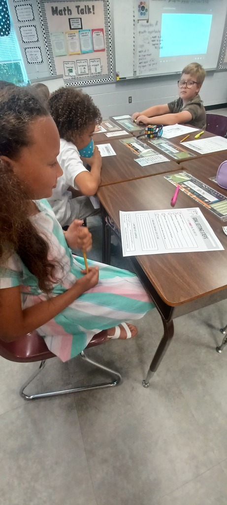 In Ms. Ciccarone's 3rd Grade class, students are pictured here practicing synonyms and antonyms with beebots. Earlier, they were learning to set goals and work toward achieving them! #teamwork