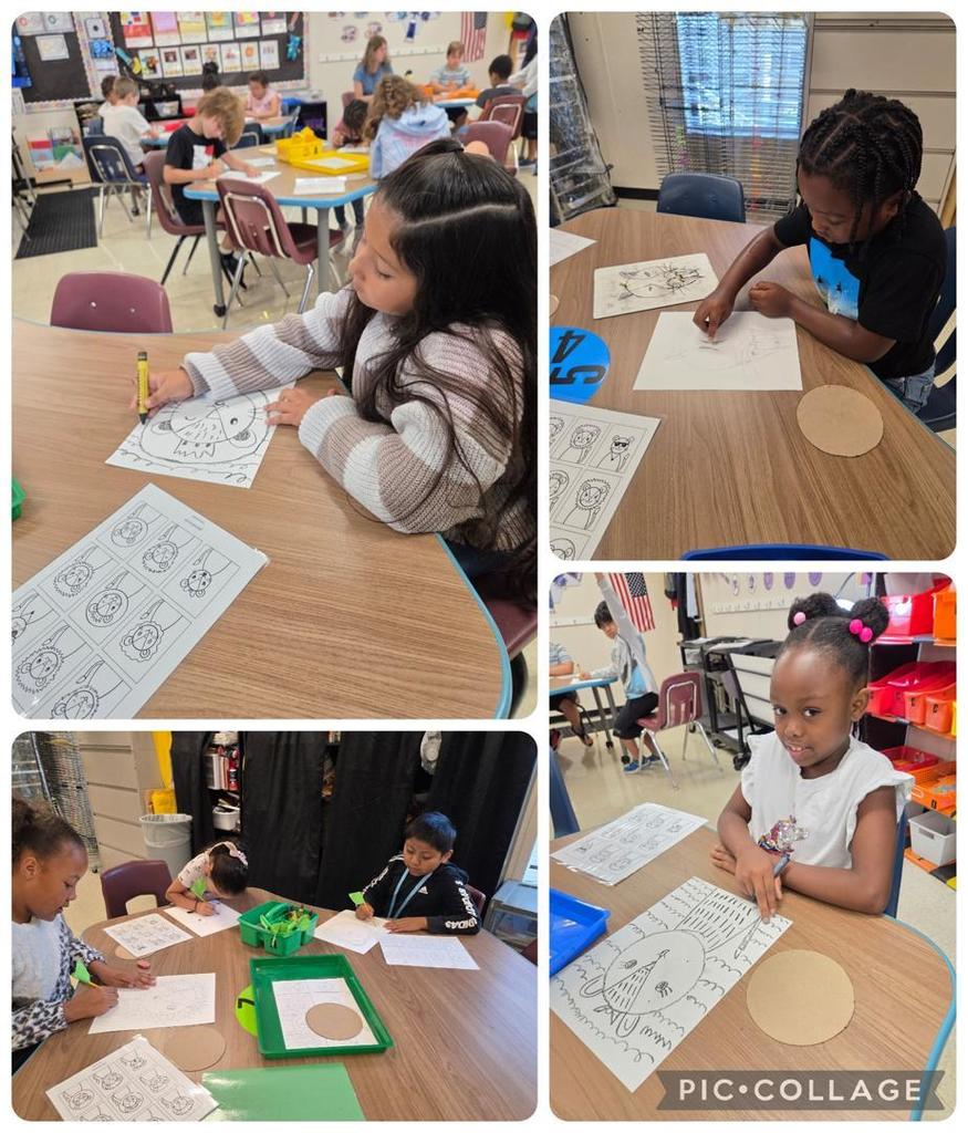 Students in a classroom working at tables, sketching and coloring animal face designs on paper using pencils and crayons.