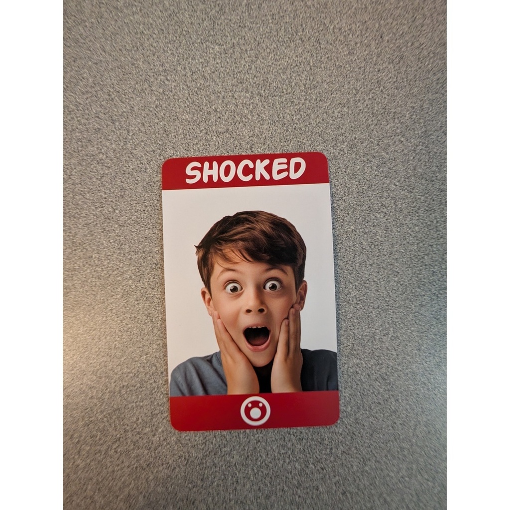 Emotion card – Shocked — A card showing a child with wide eyes and hands on cheeks, labeled “SHOCKED.”