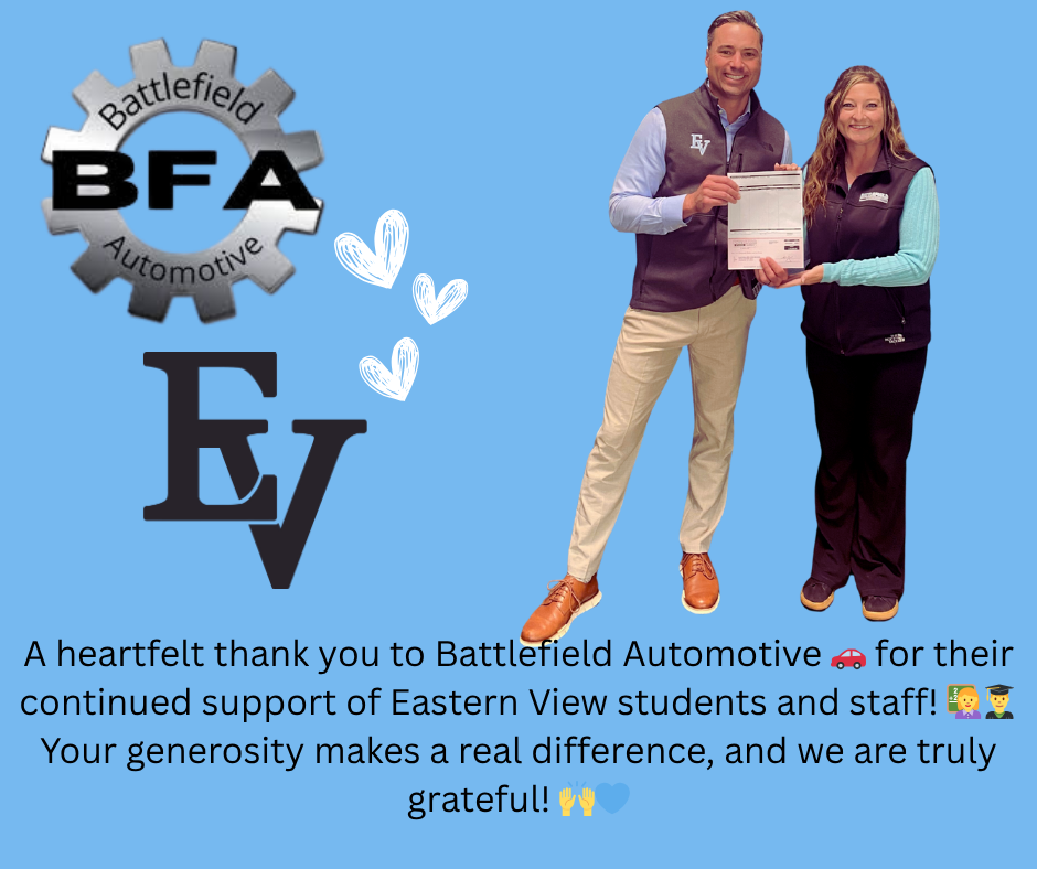 A social media appreciation post features a blue background with two prominent logos at the top left: A Battlefield Automotive logo, styled as a gray gear with the initials "BFA" in bold black letters across the center, and the words "Battlefield Automotive" wrapped around the gear's inner edge. Below it is the Eastern View (EV) logo in large black serif letters. To the right, there is a photo of two adults standing and smiling at the camera. They are both wearing black vests with the "EV" and "Battlefield Automotive" logos respectively. The man on the left is holding a document, possibly a donation or sponsorship check, and both individuals are holding it together. They appear happy and proud. Near the center of the image are three hand-drawn white heart illustrations, adding a warm, appreciative tone. At the bottom of the image, there is the following text with emojis: "A heartfelt thank you to Battlefield Automotive 🚗 for their continued support of Eastern View students and staff! 👩🏫👨🎓 Your generosity makes a real difference, and we are truly grateful! 🙌💙"