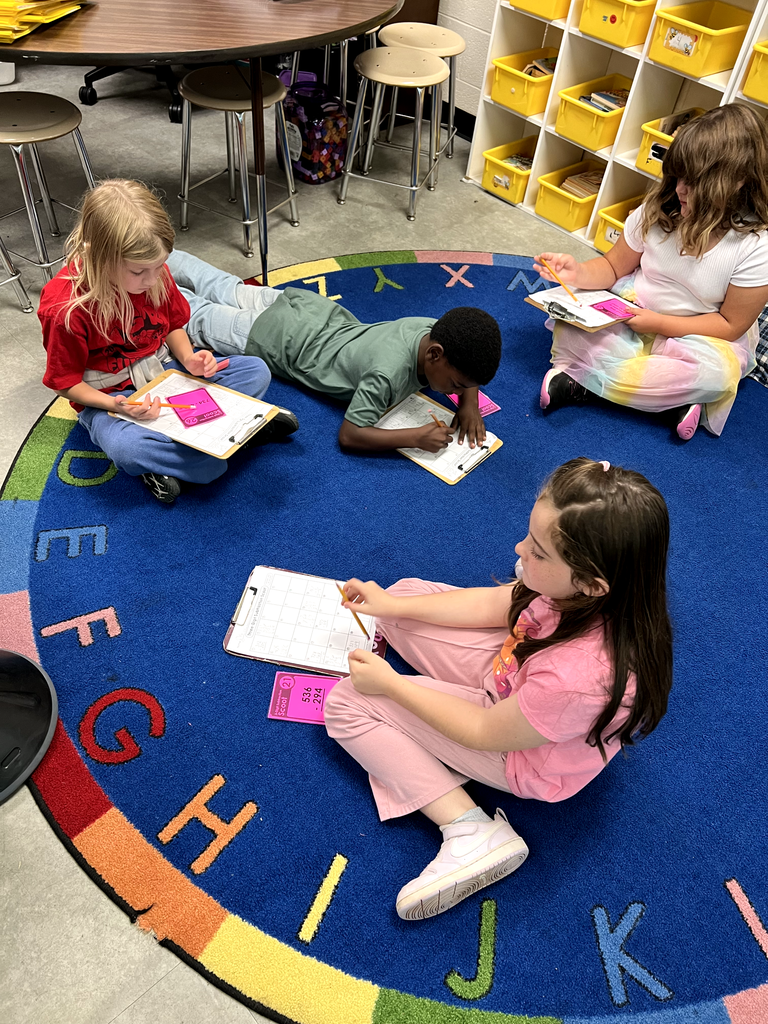 Pictured here are Mrs. McFarland's 3rd graders playing subtraction scoot to practice subtracting 3 digit numbers.  Great job!