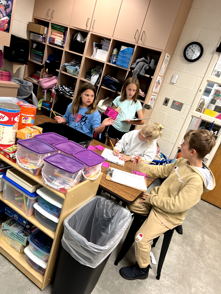 Pictured here are Mrs. McFarland's 3rd graders playing subtraction scoot to practice subtracting 3 digit numbers.  Great job!