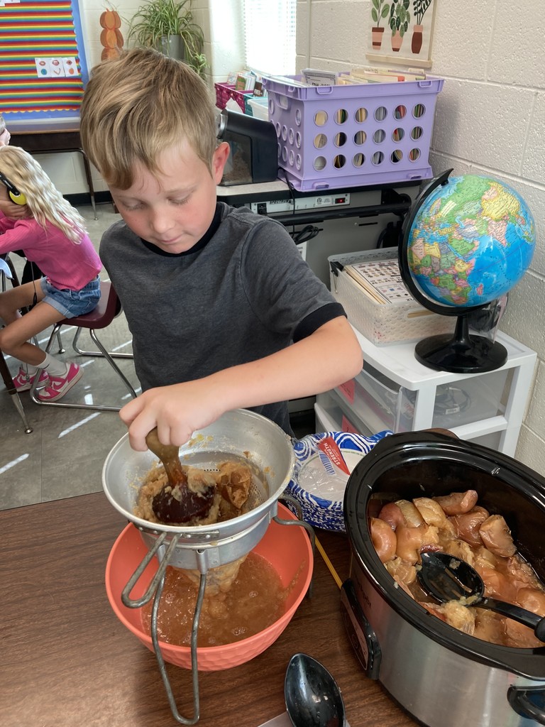 Pictured here are Mrs. Aylor's 2nd Graders making and enjoying some applesauce!