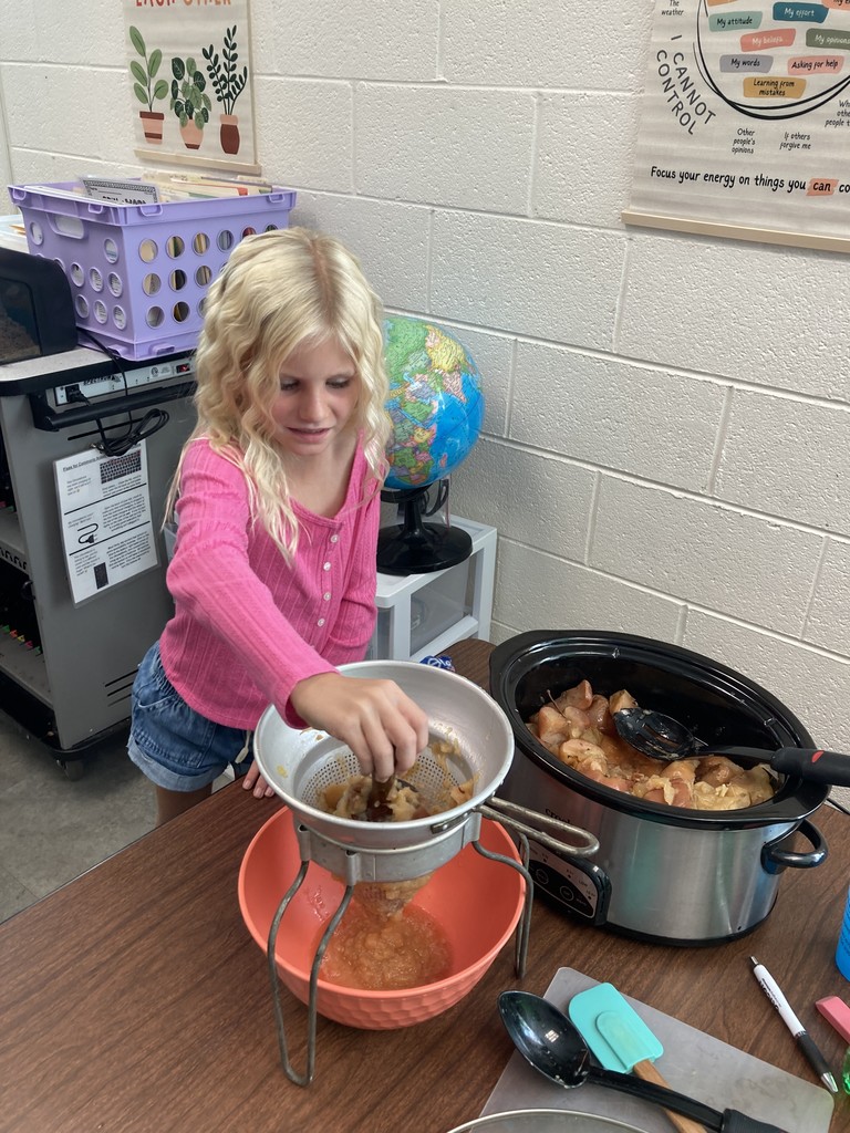 Pictured here are Mrs. Aylor's 2nd Graders making and enjoying some applesauce!