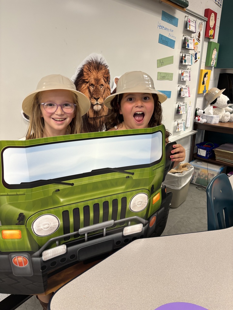 Third grade students participating in jungle themed activities in Mrs. Burgh's transformed jungle classroom.