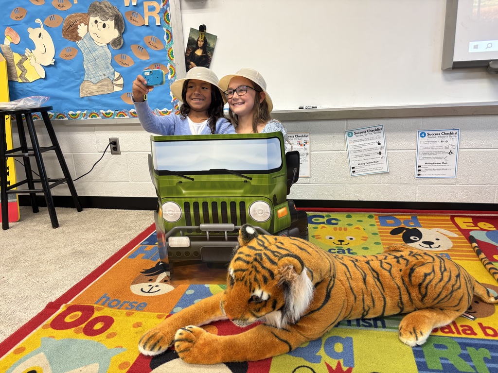 Third grade students participating in jungle themed activities in Mrs. Burgh's transformed jungle classroom.