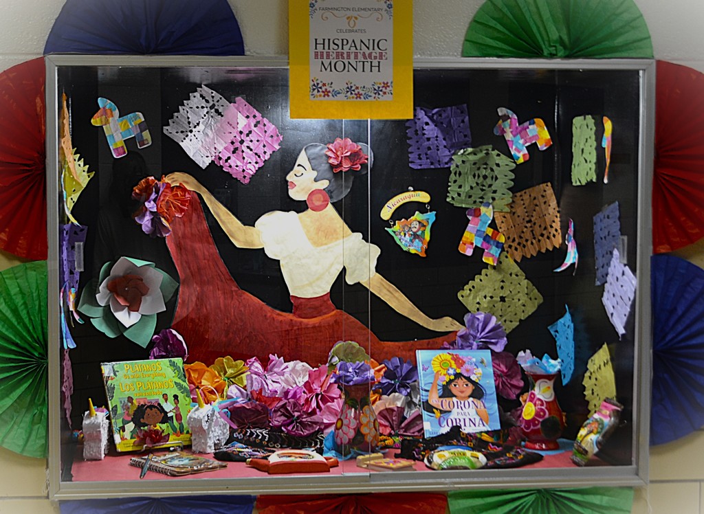 Showcase for Hispanic Heritage Month- Latina dancer with papel picado and other decorations from Latin America countries