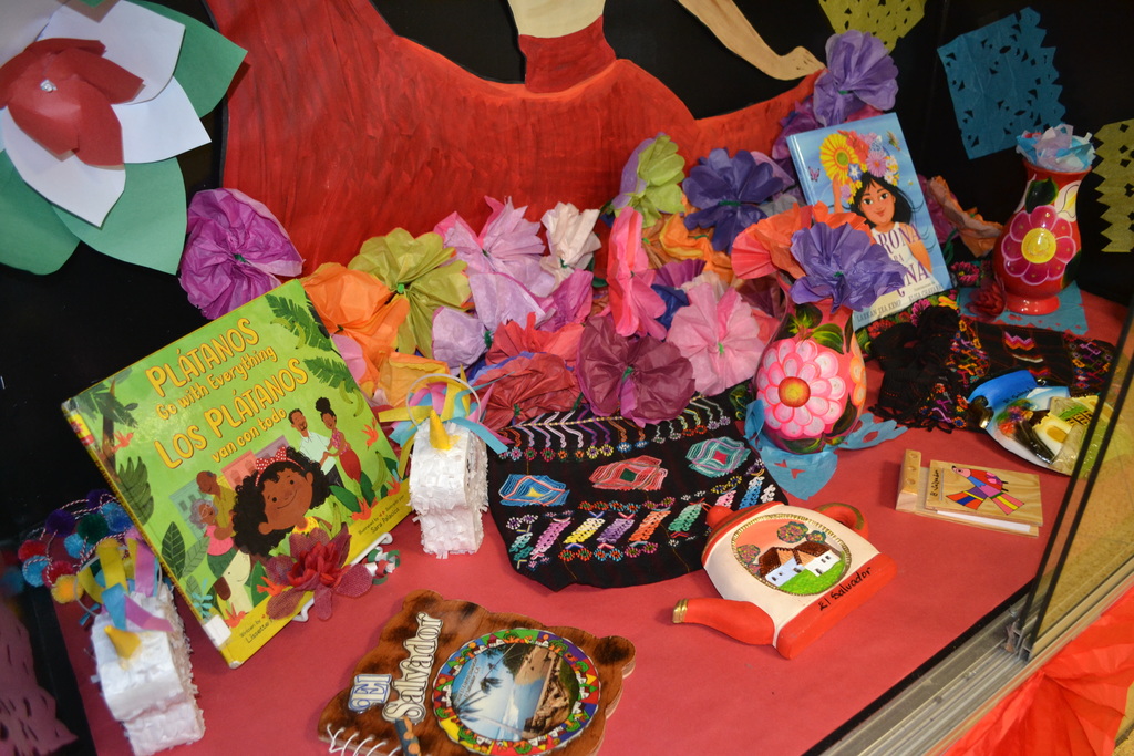 Showcase for Hispanic Heritage Month- Latina dancer with papel picado and other decorations from Latin America countries