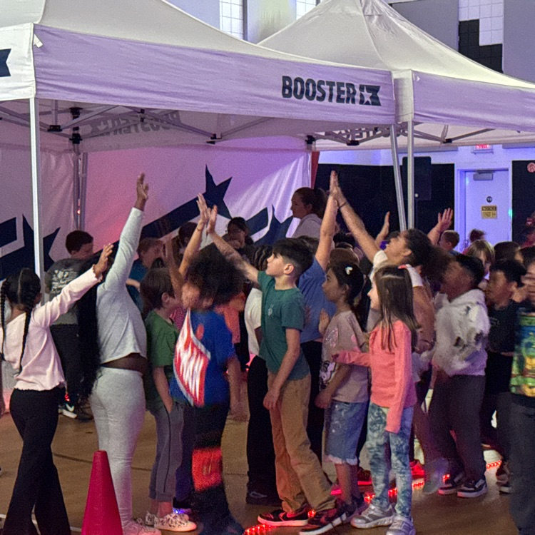 students giving high-fives during the glow run