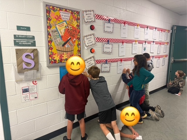 3rd grade students doing a vocabulary activity in the hallway