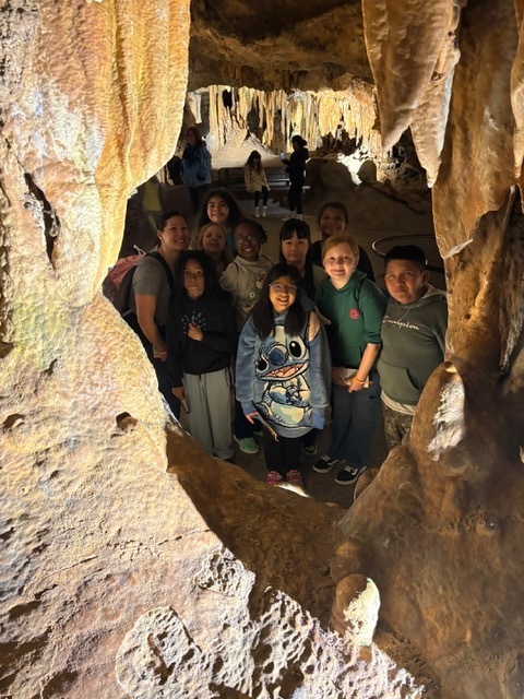 Image contains a group of kids with their chaperon in the Luray Caverns.