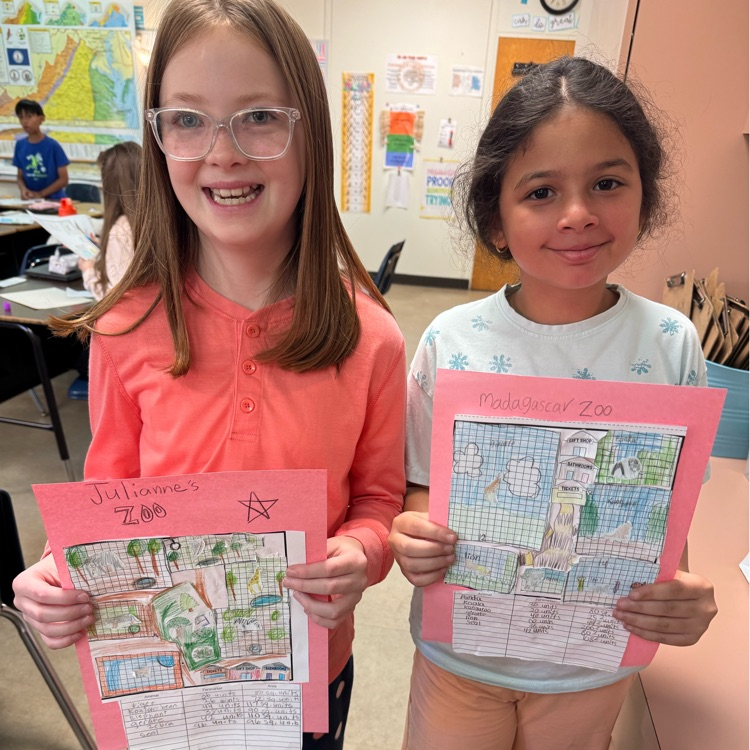two girls showing off their zoos