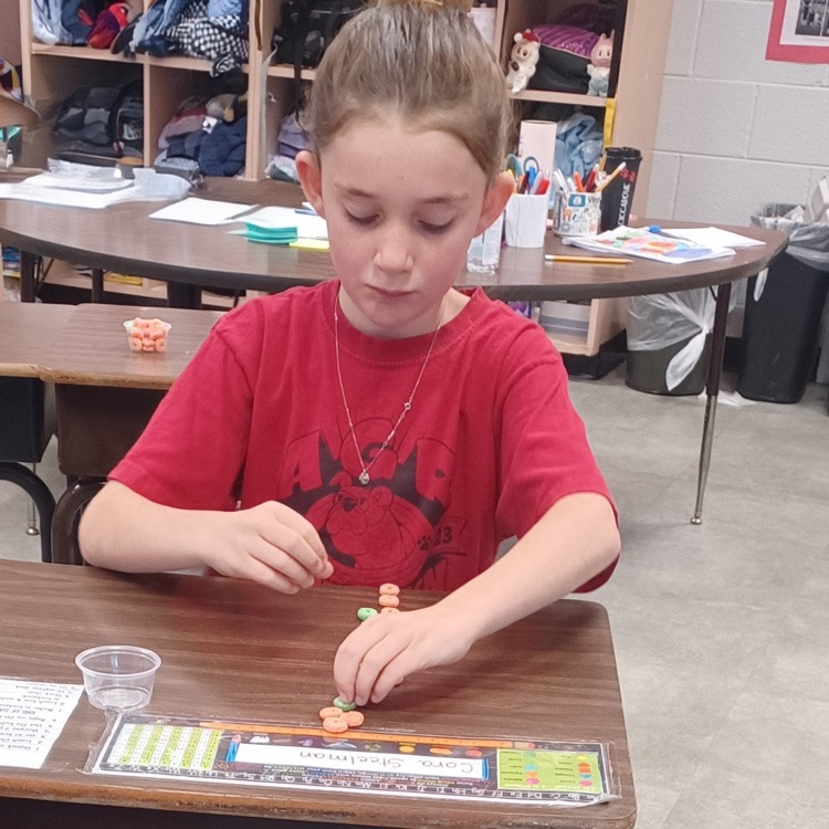 Meanwhile, down the hall in Ms. Ciccarone's third grade class, student   were using cereal to practice multiplication arrays.