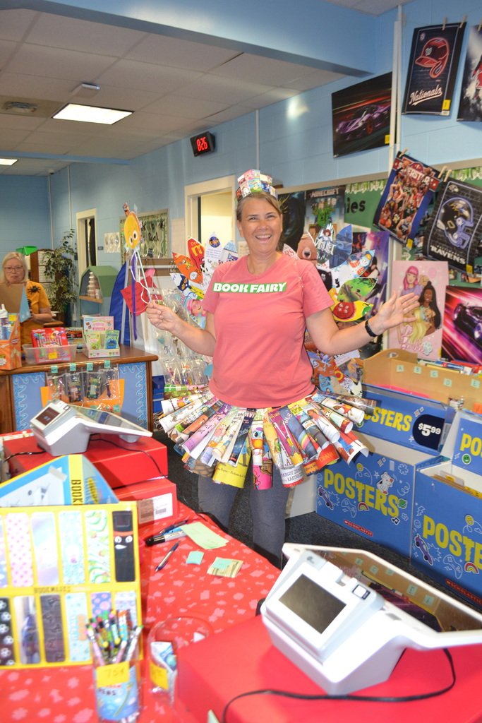 Teacher dressed as the Book Fairy in the school library during Book fair.