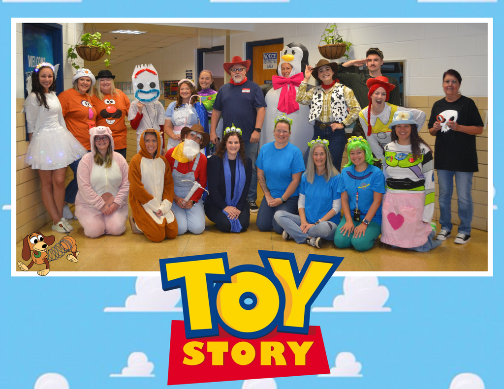 Staff dressed in Toy Story themed costumes pose in the main hallway. TOY STORY