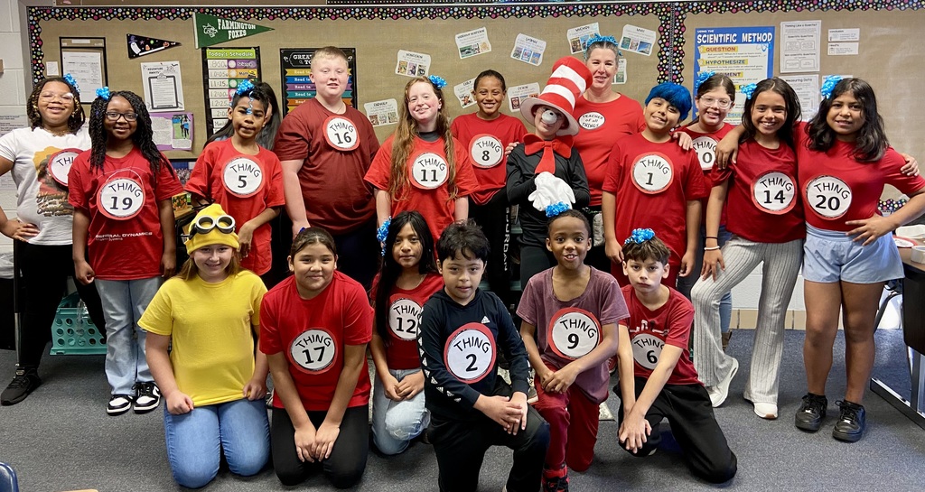 A group of students dressed from Dr Seuss as Thing 1 to Thing 20