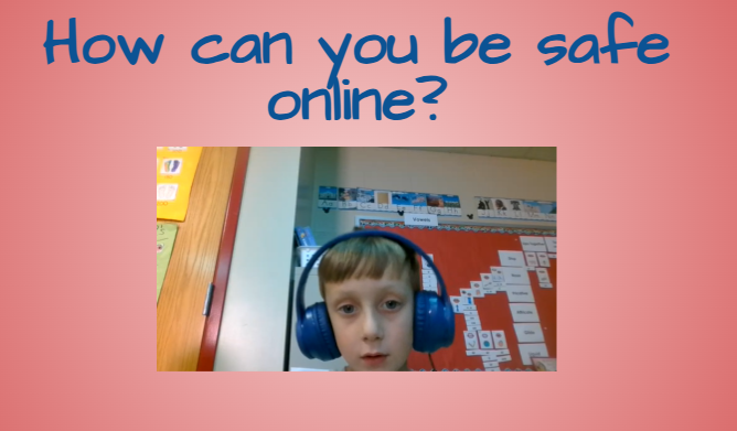 A screenshot of another student recording their Internet Safety PSA with a pink background slide titled “How can you be safe online?” The student wears blue headphones and speaks from their classroom.