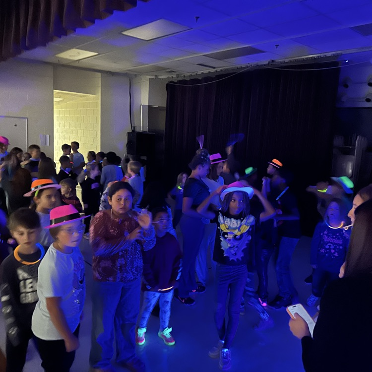 pictured here our students enjoying two different activities - donuts, insider at lunch and a glow party in the afternoon