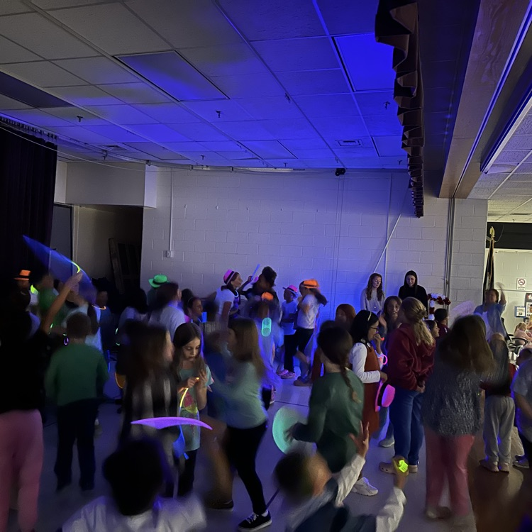 pictured here our students enjoying two different activities - donuts, insider at lunch and a glow party in the afternoon