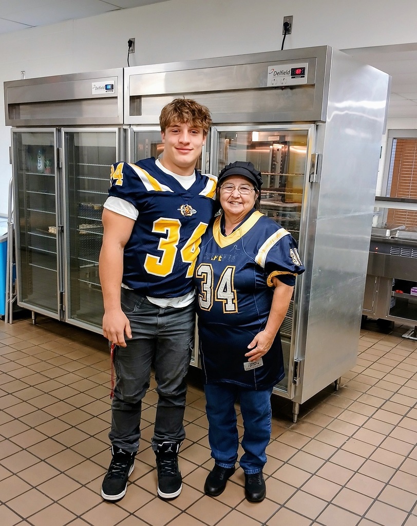Riley Vinyard posing with cafeteria worker, Mrs. Terre Slabaugh. 