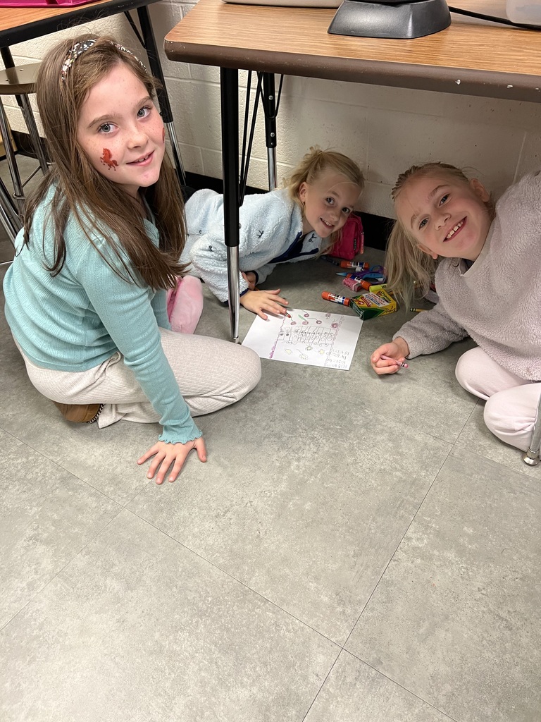 This week, Mrs. McFarland's 3rd Graders read the book "Divide and Ride" and learned about how carnival ride operators use division to know how many people can ride each ride. Students worked in small groups to create their own carnival ride, and wrote the math fact to show what they understood about division!