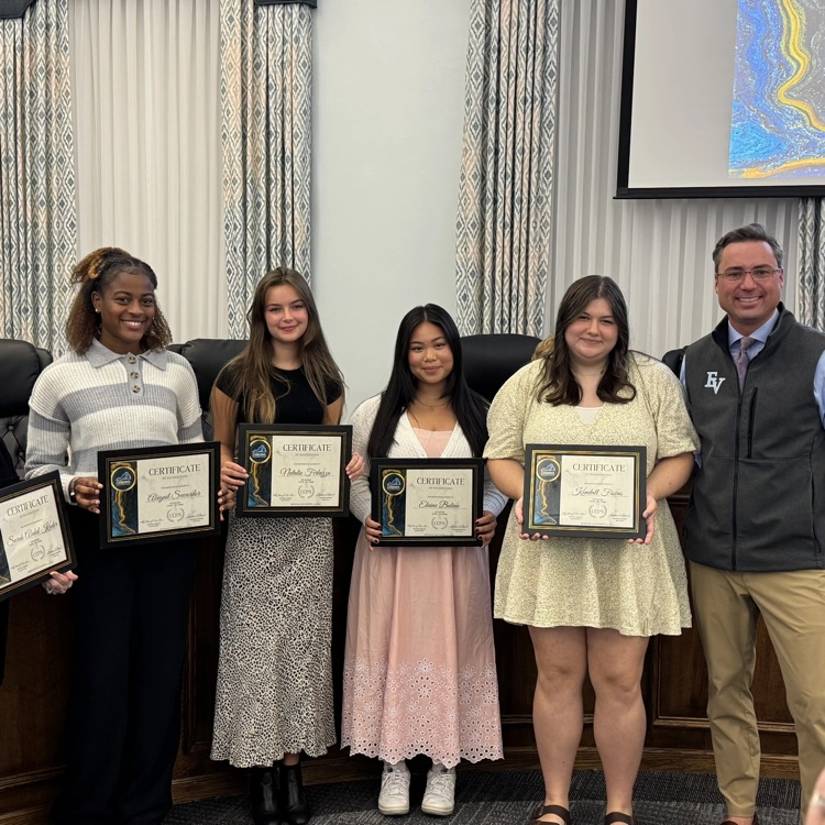 4 high school students flanked by a school board member and principal recognized for being an AP Scholar; 