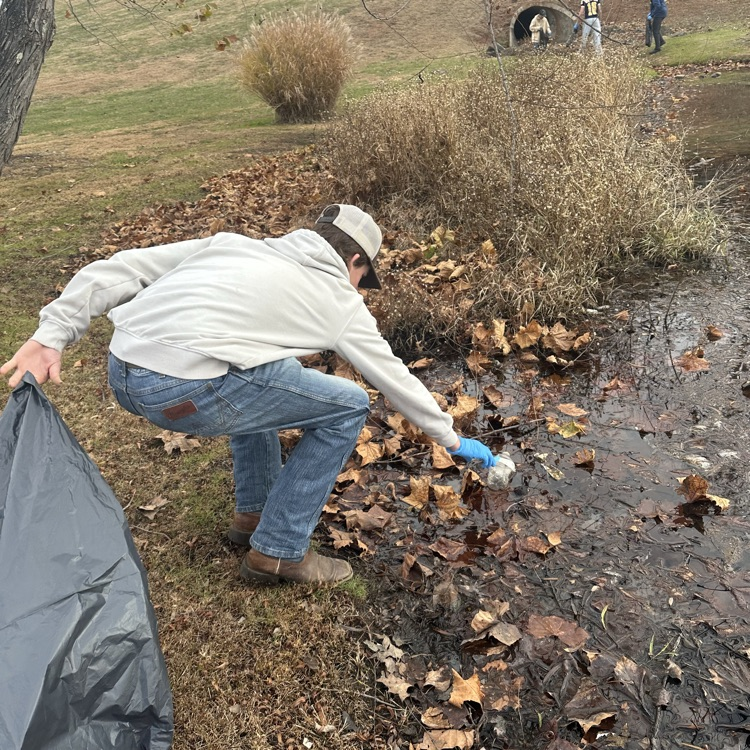 fishing club cleaning up a local pond