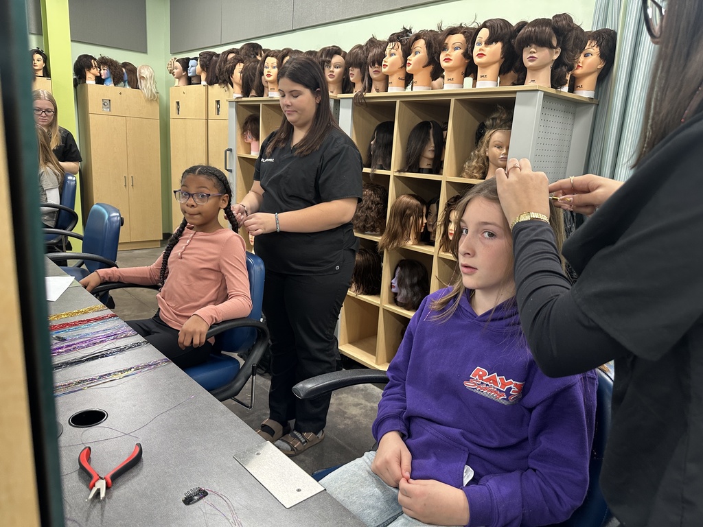Two girls exploring cosmetology