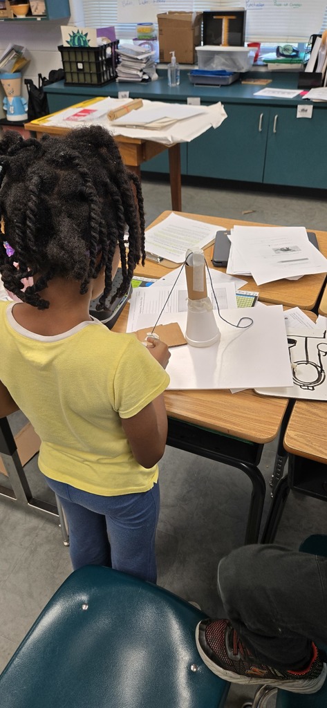 3rd graders building contraptions to solve a STEM challenge3rd graders building contraptions to solve a STEM challenge