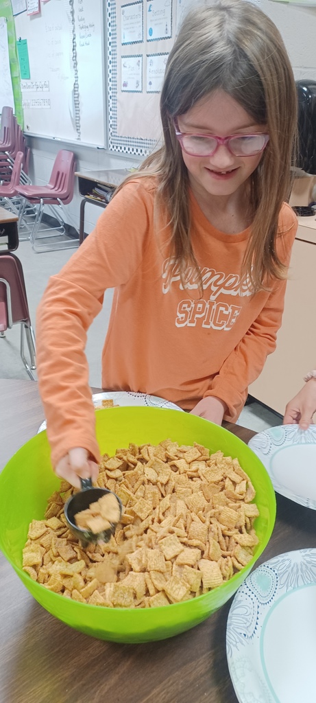 Several third grade classes watched The Charlie Brown Thanksgiving and then used measurement skills to create Snoopy’s recipe for Thanksgiving,  which includes jelly beans, toast, popcorn, and pretzels. Pictured are Ms. Ciccarone's class enjoying a yummy math class!